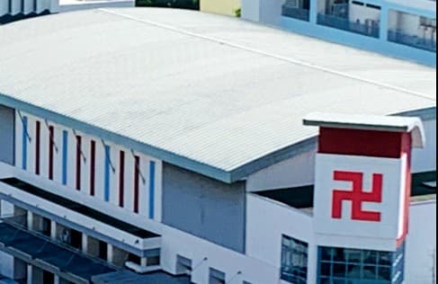 Red Swastika School sports hall The sports hall of Red Swastika School in Bedok, with the school crest on its end wall